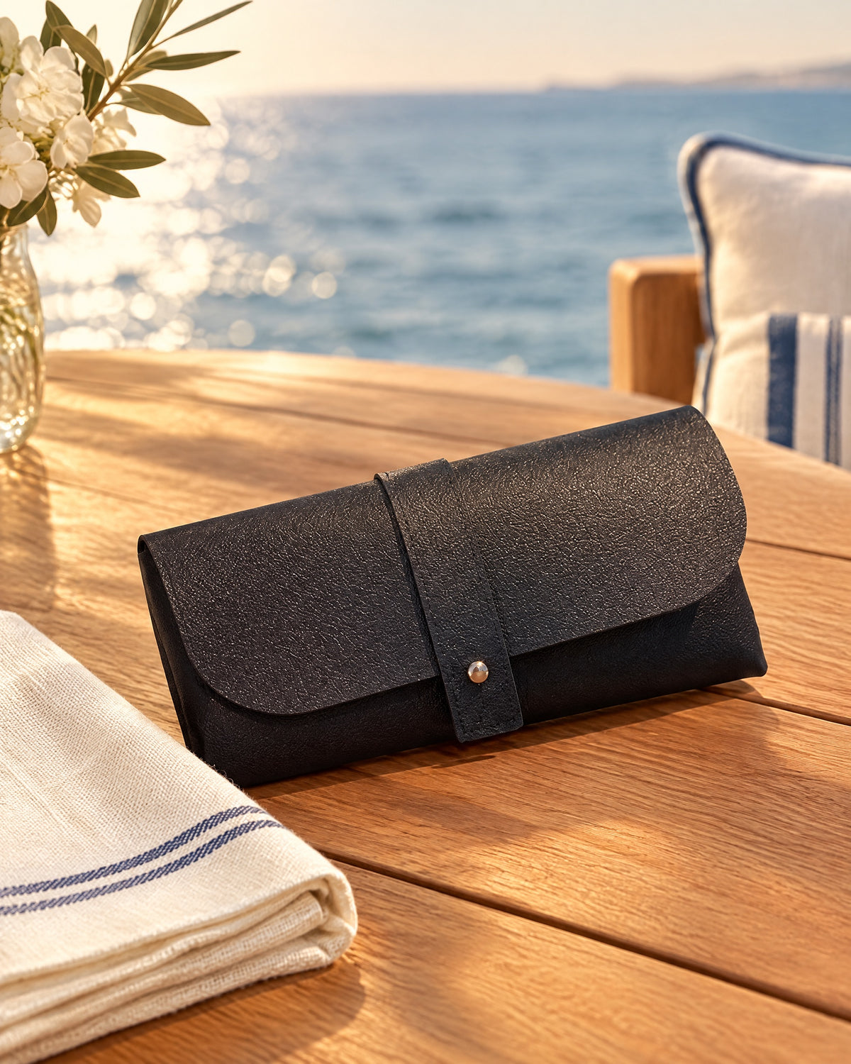 Rimless Oval Metal Sunglasses in Black leather buckle box — still life