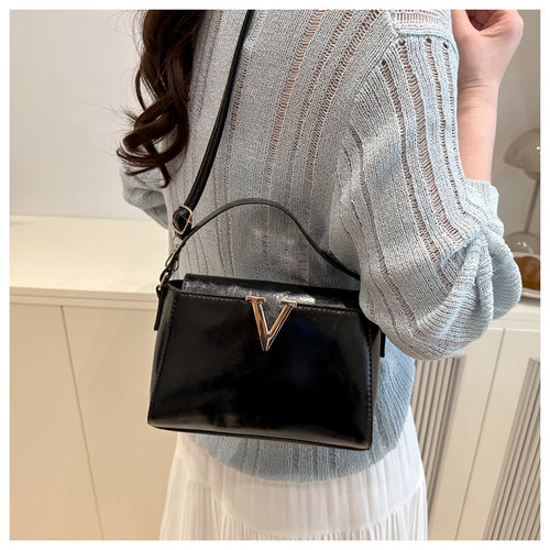 Boxy Top-Handle Crossbody Bag in Black — on model