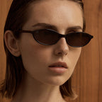 Slim Oval Sunglasses in Brown/Brown — on model
