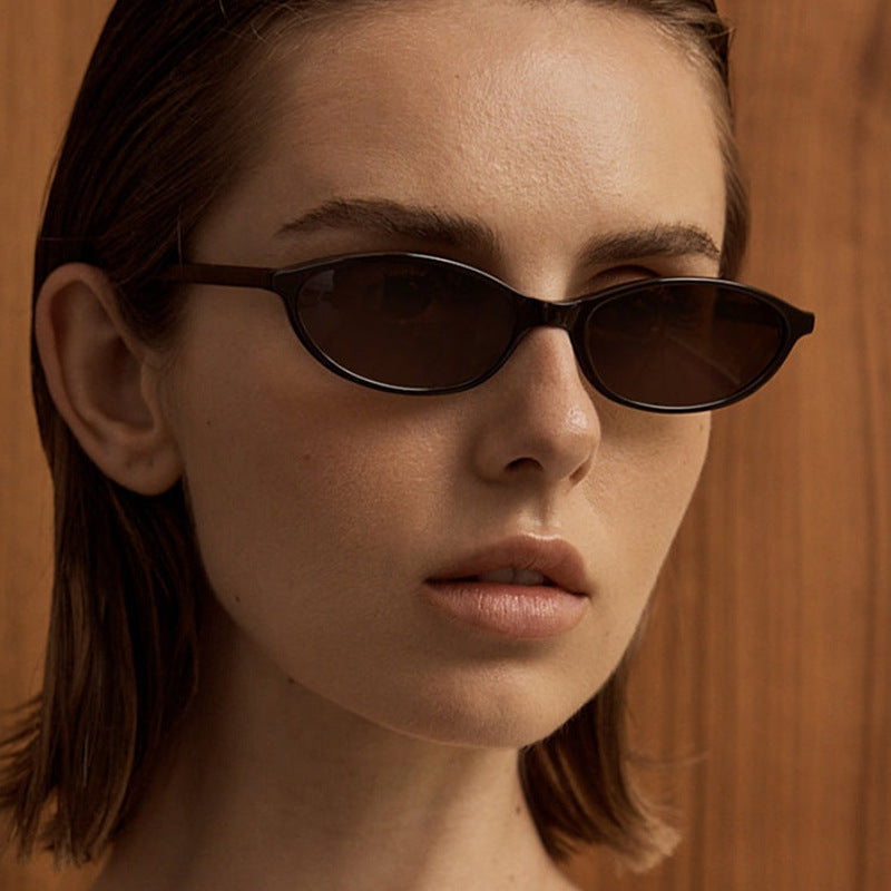 Slim Oval Sunglasses in Brown/Brown — on model