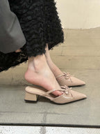 Bow-Strap Block-Heel Mules in Beige — on model
