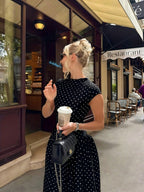 Cap-Sleeve Polka Dot Maxi Dress in Black — on model