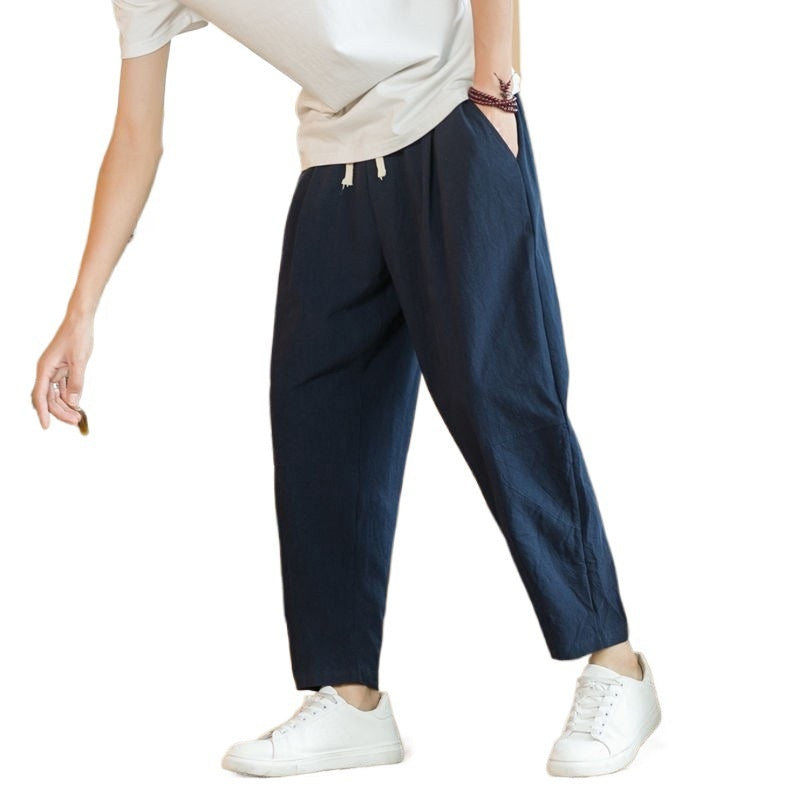 Drawstring Tapered Trousers in Navy — on model