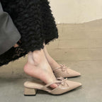 Bow-Strap Block-Heel Mules in Beige — on model