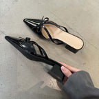 Bow-Strap Block-Heel Mules in Black — flat lay