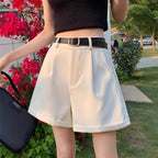 Pleated Trouser Shorts in White — on model
