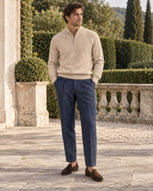 Man wearing the Camel Half-Zip Outfit: camel wool half-zip pullover and navy herringbone side-tab trousers