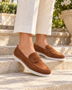 White-Sole Suede Penny Loafers in Tobacco — on model