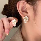 Floral Pearl Earrings in Gold and White — on model