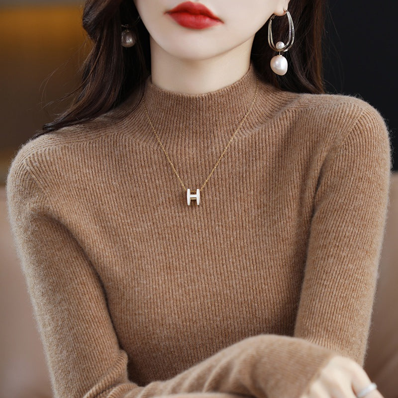 Seamless Wool-Blend Mock-Neck Sweater in Camel — on model