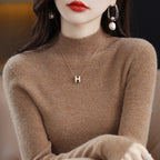Seamless Wool-Blend Mock-Neck Sweater in Camel — on model
