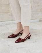 Buckle-Strap Slingback Kitten Heels in Burgundy — on model