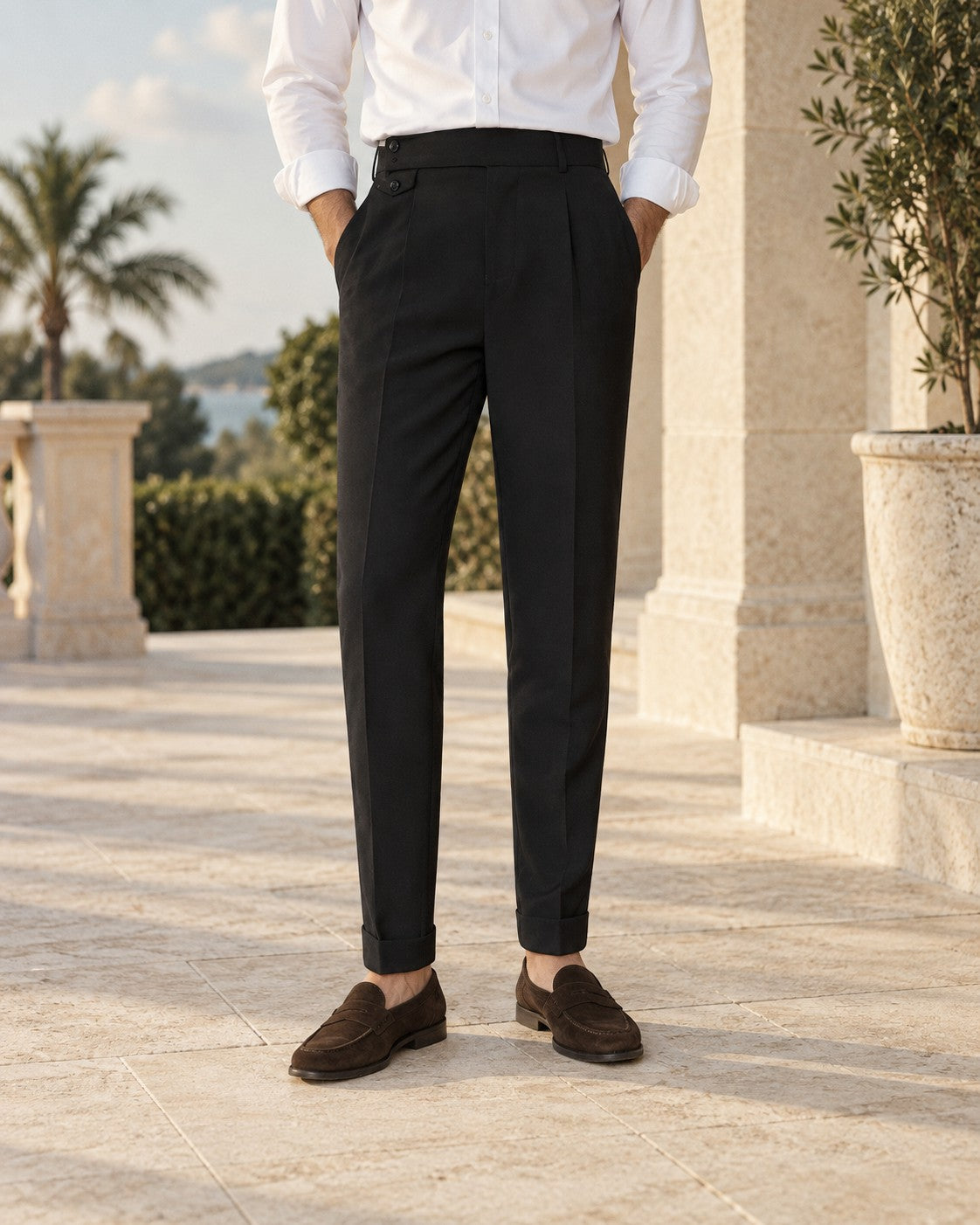 Pleated Cropped Trousers in Black — on model